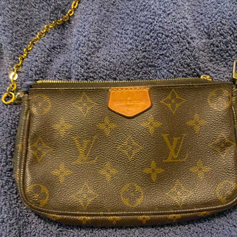Authentic Louis Vuitton pouch with chain part of double pouch collection
